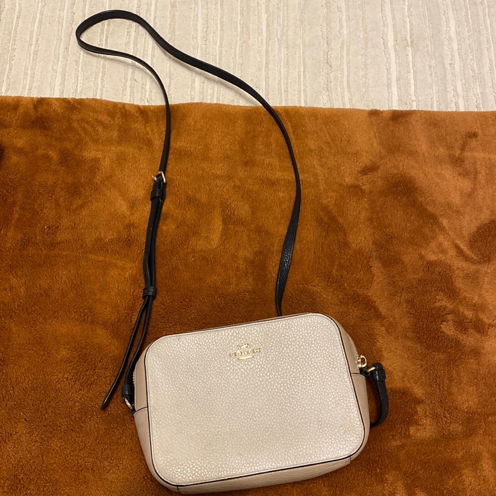 Coach crossbody, colors cream, tan, and black.